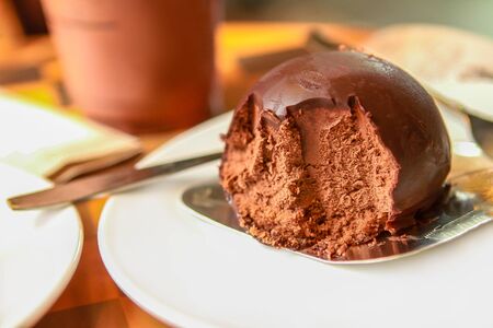 Chocolate flavored ice cream on a plate in a restaurant