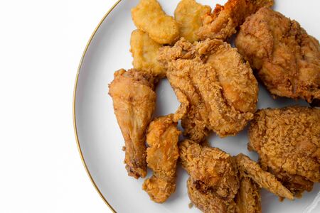 Set of fried chicken on a white plateの写真素材