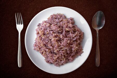 Organic rice in a White plate of Thai style foodの写真素材