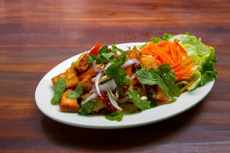 yum spicy The belly meat of salmon salad in Thai Style cuisineの写真素材