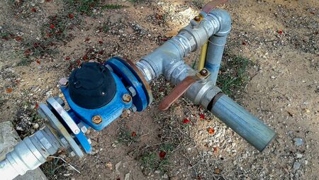 Blue iron street column for drinking water. Old rural water supply system of the population. Click...