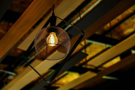 Vintage or retro lamp on old wall in home, Feeling romantic in old home with retro light, Lighting equipment in interior home with dark light picture styleの写真素材