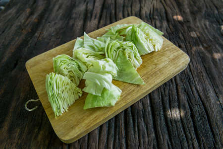 broccoli cabbage on wood board. Fresh green organic broccoli vegetable on a woofen cutting board on...