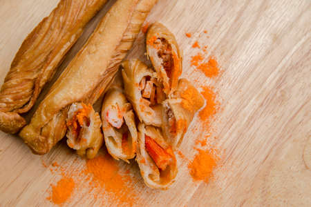 Thai bread, puff stick, sliced on a wooden tray