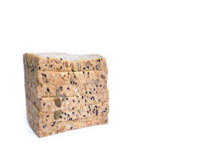 Fresh delicious whole wheat bread isolated on a white background. Top view image of cut of loaf...