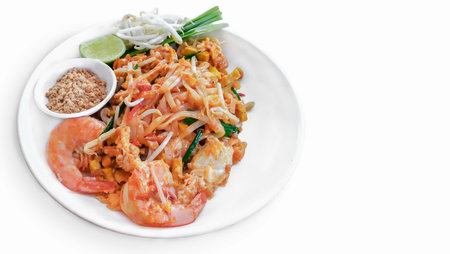 Top view of Thai traditional food Pad Thai Noodles with shrimp in dish on wooden tableの写真素材