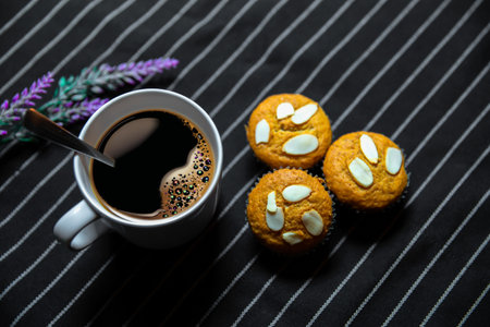 Cup of Coffee with a Cookies and brown shugar. Symbolic image. Coffee background. Sweet dessert. Wooden backgroundの写真素材