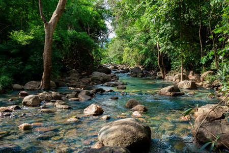 Mountain river with stones. Fast water current. Water photo texture. Grey river in tropics wallpaper. Rafting river in forest. Splashy fast river texture. Natural water texture. Fresh spring top viewの写真素材