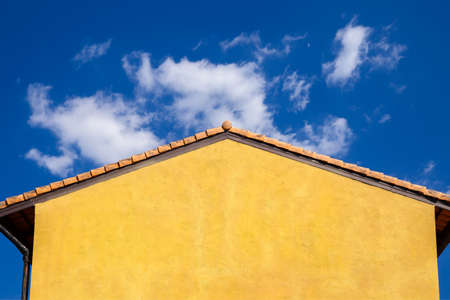 The walls and roofs of the ancient buildings are painted in vintage-style orange tonesの写真素材