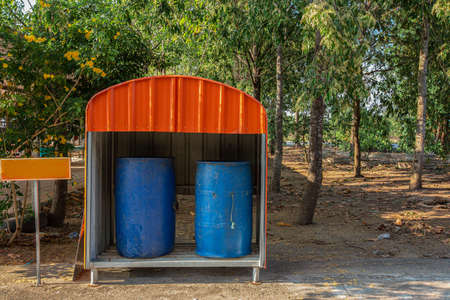 Trash container in different Trashcans For Collection Of Recycle Materials in the park with Sun light. Trash Garbage blue color Disposal Classification conceptの写真素材