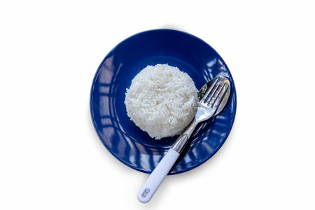 white rice on a plate. rice isolated on white background. rice top view .Asian healthy foodの写真素材