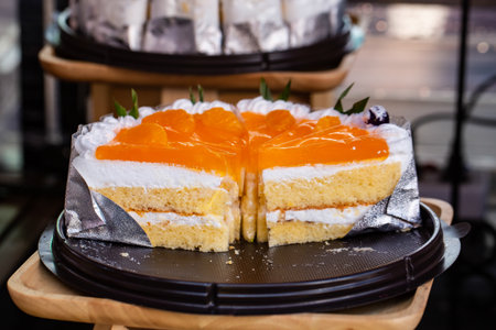 Orange cake on a tray in a coffee shopの写真素材