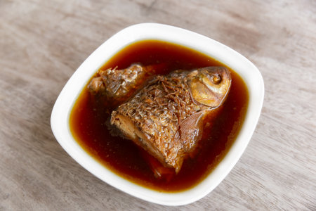 fish boiled with salt on wood table thaifoodの写真素材