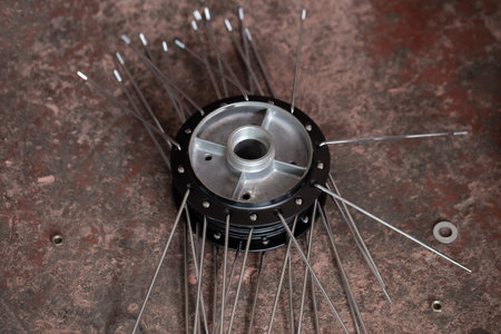 A strong steel bar used as a replacement part for motorcycle wheels.