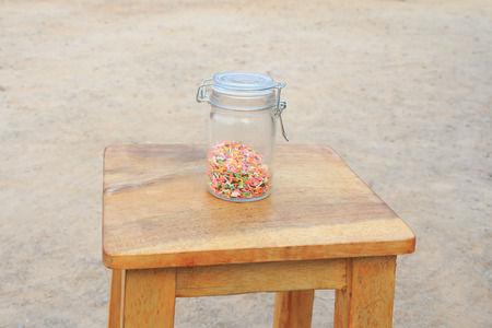 Jar glass with sweetmeats on the chairの写真素材