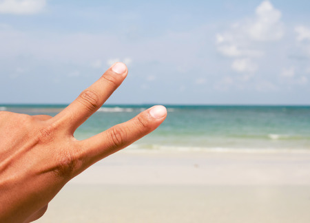 One hand making a peaceの写真素材