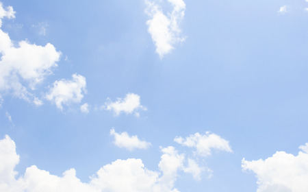 White fluffy clouds in the blue skyの写真素材