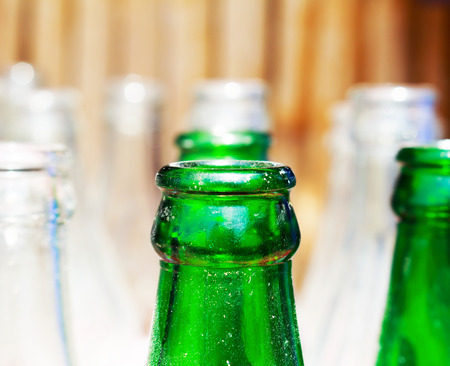Fresh alcohol drink in the bottles with green bottlesの写真素材