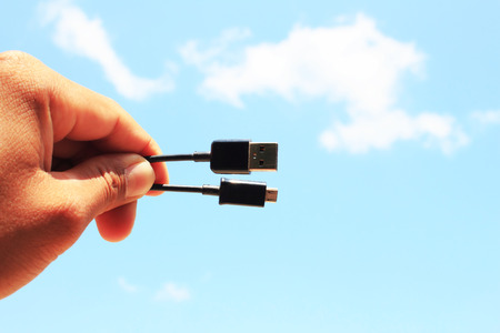 Macro image of a hand holding usbの写真素材