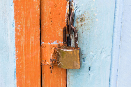 Big old rusty open padlockの写真素材