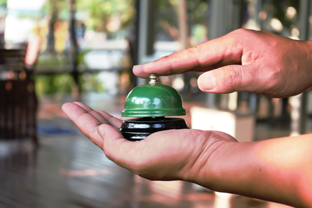 Hand man push hotel bellの写真素材