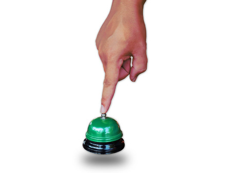 Hand man push hotel bell  on white.