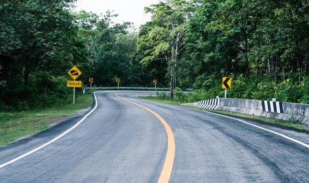 Cars running on road It was raining, the road is slippery.の写真素材