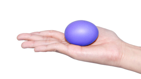 hand holding egg easter day isolated on white backgroundの写真素材