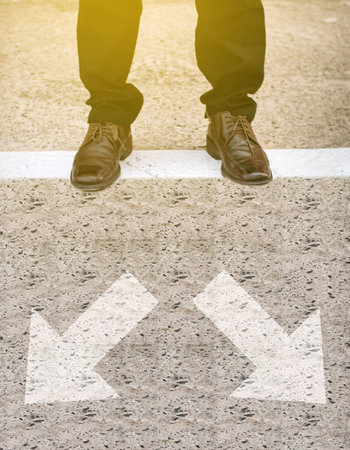 Brown Leather Shoe on the roadの写真素材