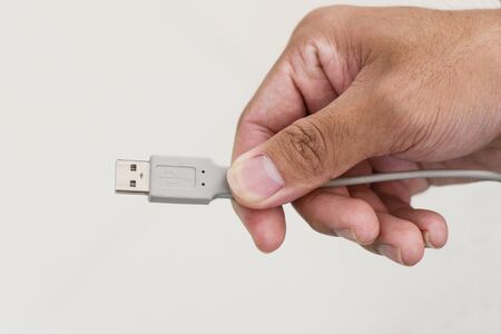 hand holding USB cable hub