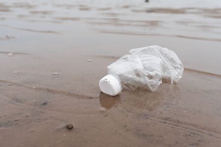 Plastic water bottles pollution in the ocean (Environment concept)