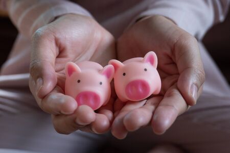 Piggy bank metaphor saving love for lover or family in every day.Concept of happy relationship.の写真素材