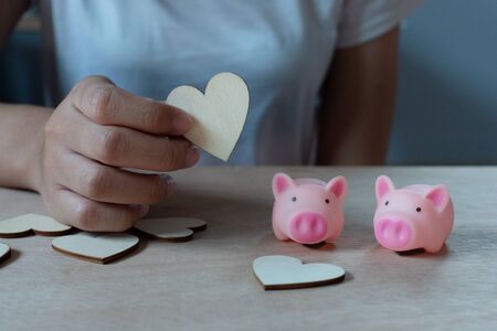 Piggy bank metaphor saving love for lover or family in every day.Concept of happy relationship.の写真素材
