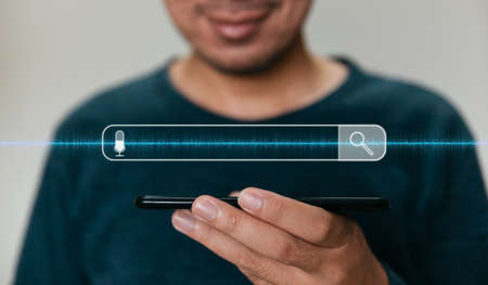 Close up hands holding smartphone. man working with smart phone and with blank search bar. Searching Browsing Internet Data Information Networking Conceptの写真素材