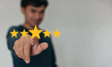 Customer hand  holding smart phone and five star with copy space. Best Excellent Services Rating for...