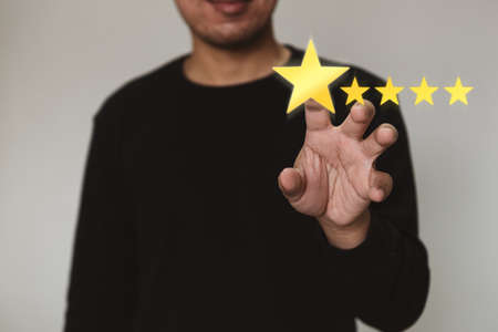 Businessmen selecting the level of satisfaction score icons with copy space. Customer service...
