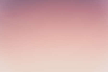 Abstract gradient sunrise in the sky with blue smooth blurred purple and orange natural background.