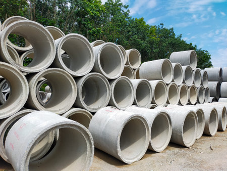 Concrete drainage pipes in the construction site, ready for installation.