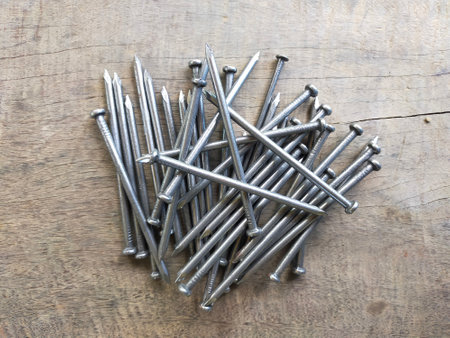 Nails for driving wood  on the old wooden floor.の写真素材