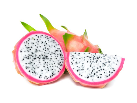 Juicy pink dragon fruit with white flesh and black seeds lies on a white background.の写真素材