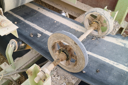 Black wheels pull the belt conveyor rock.の写真素材