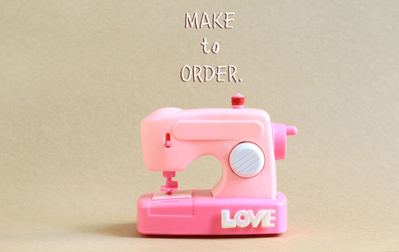 Model Pink Sewing machine with font "Make to Order"の写真素材