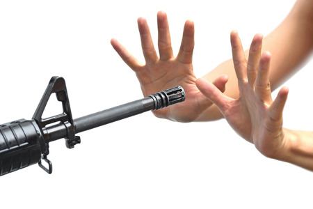 a rifle pointing at empty handsの写真素材