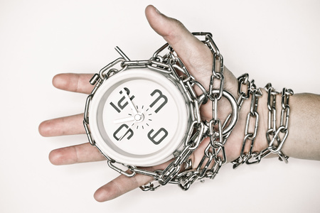 arm chained with a clockの写真素材