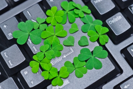enter button covered with green heart shaped leaves の写真素材