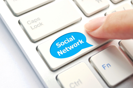 finger pressing social network button
