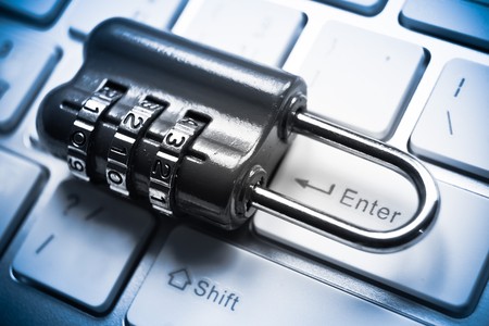 metal security lock with password on computer keyboard - security concept in computer
