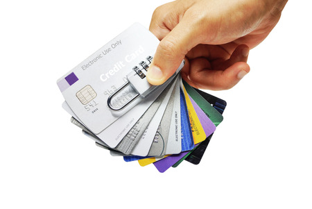 hand holding credit cards with security lock