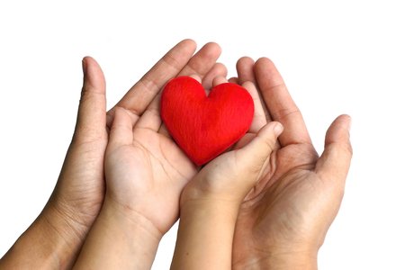mother and a child holding a red heart together