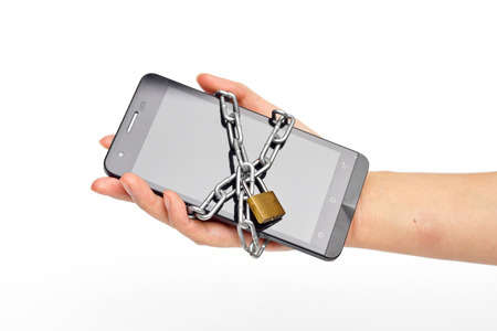 hand holding a chained smartphone